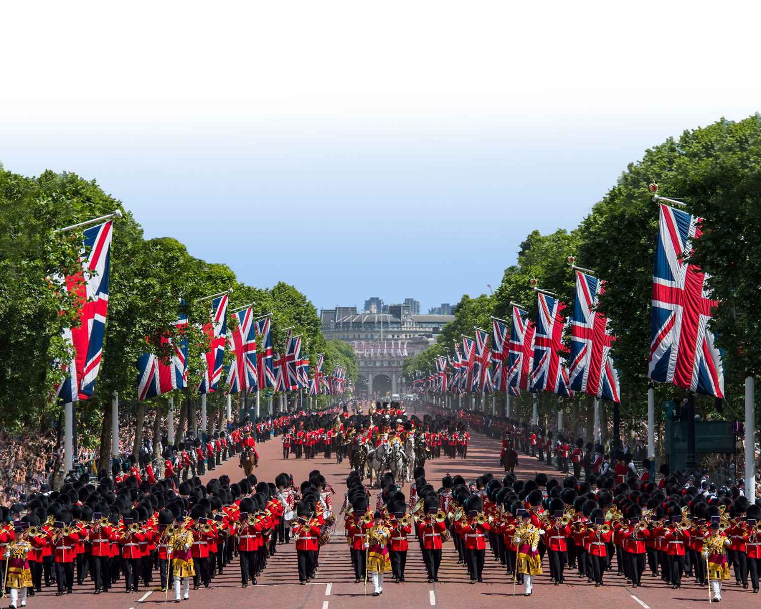 Soldiers of the Mass Bands and Household division marching in front of and behind HRH Queen Elizabeth returning back to Buckingham Palace.